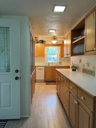 Hyannis Cape Cod vacation rental - Kitchen w/front entry door on left.
