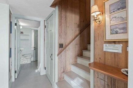 Orleans Cape Cod vacation rental - View of the hallway to staircase and first floor bathroom