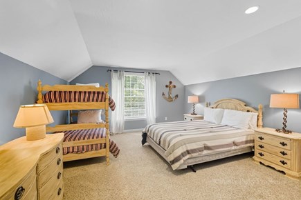 Brewster Cape Cod vacation rental - Additional sleeping quarters upstairs featuring queen bed and bunkbed.