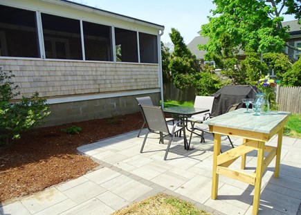 Barnstable Cape Cod vacation rental - Back patio with grill, dining area 