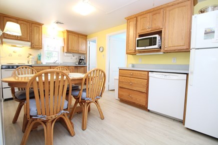 Wellfleet Cape Cod vacation rental - Eat in Kitchen Area Showing Twin Room Door and Bathroom Door