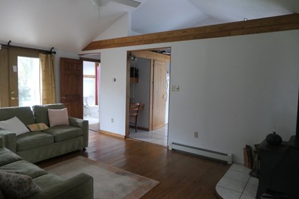 Eastham Cape Cod vacation rental - Living room w/ second full bathroom, slider out to backyard
