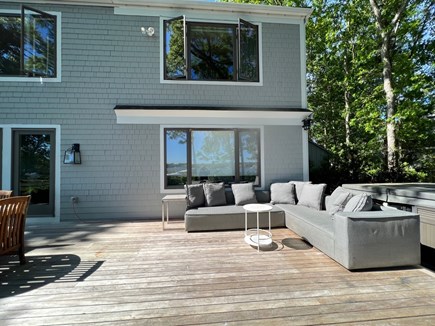 New Seabury, Mashpee Cape Cod vacation rental - Back Deck seating area and hot tub<br/>With water views