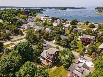 Pocasset Cape Cod vacation rental - Aerial shot showing neighborhood, backyard and Buzzard’s Bay.
