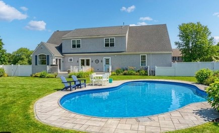 East Sandwich Cape Cod vacation rental - Backyard features in ground pool & large deck with table for 10.