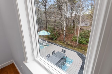 Dennis Cape Cod vacation rental - Second floor primary bedroom view of back deck