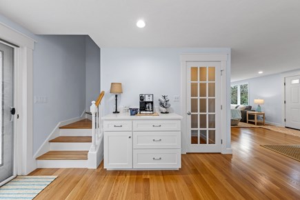 Dennis Cape Cod vacation rental - Open kitchen; stairs to 2nd floor; glass door to laundry area