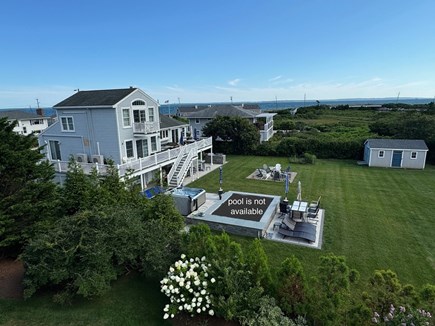 East Falmouth Cape Cod vacation rental - Back of house and yard with Martha's Vineyard in the distance