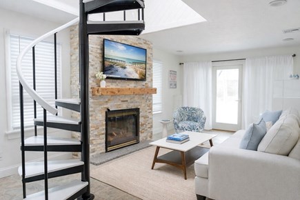 Plymouth, White Horse Beach MA vacation rental - Bright coastal living room with spiral stair to master bedroom.