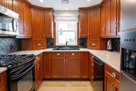 Plymouth, White Horse Beach MA vacation rental - Updated kitchen with warm wood cabinetry & modern appliances