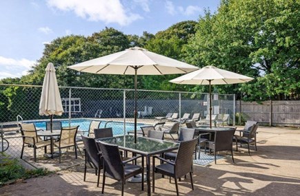 Dennis Cape Cod vacation rental - Patio updated with dining table, couch, fire pit, and grill