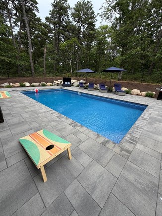 Harwich Cape Cod vacation rental - Pool area with loungers and umbrellas.  Sit back, and unwind