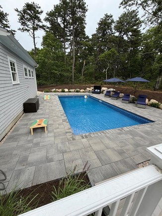 Harwich Cape Cod vacation rental - Pool area with loungers and umbrellas.  Sit back, and unwind