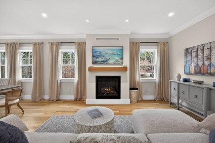 Harwich Cape Cod vacation rental - Relax in the living room with gas fireplace Smart Frame TV