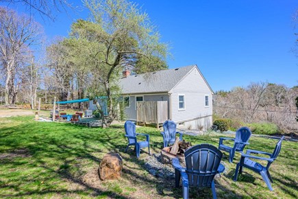 Eastham Cape Cod vacation rental - View of back with with firepit
