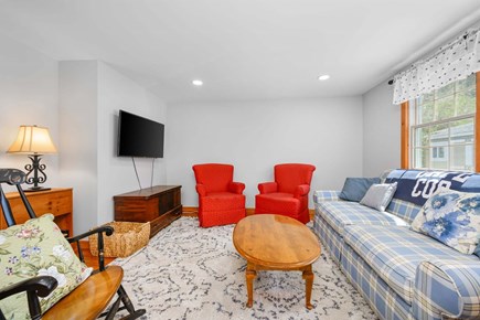 Osterville Cape Cod vacation rental - Living room with TV, blending modern comfort with classic cottage style.