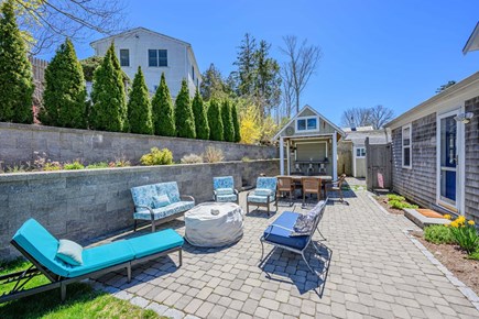Osterville Cape Cod vacation rental - Patio with seating and a fire pit, perfect for relaxing evenings outdoors