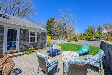 Osterville Cape Cod vacation rental - Patio with seating and a peaceful view of the side yard.