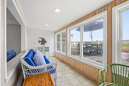 Bourne, Buzzards Bay Cape Cod vacation rental - Sunroom featuring a bright, relaxing space filled with natural light, perfect for enjoying the views and unwinding throughout the day.