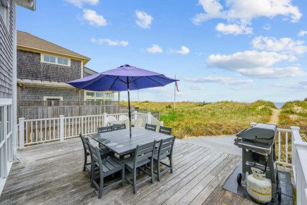 Bourne, Buzzards Bay Cape Cod vacation rental - Outdoor deck featuring a dining table, creating a comfortable space