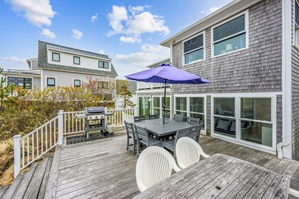 Bourne, Buzzards Bay Cape Cod vacation rental - Deck featuring a table and grill, offering a comfortable outdoor space for dining