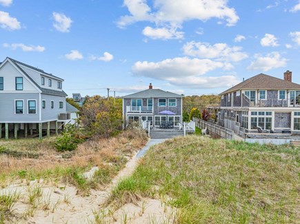Bourne, Buzzards Bay Cape Cod vacation rental - View of the back deck and walkway to the beach