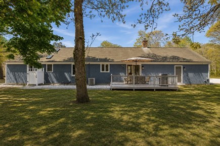 Brewster Cape Cod vacation rental - Blue Cape Cod exterior with yard, deck & outdoor shower