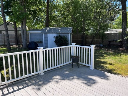 West Dennis Cape Cod vacation rental - Back Deck and left side of backyard (with grill by the shed)