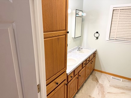 Harwich Cape Cod vacation rental - Two sink bathroom with a spacious shower.