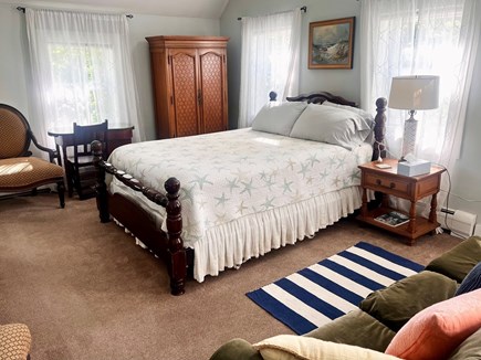 Brewster Cape Cod vacation rental - Main queen bedroom, lofted ceiling, open beams, ceiling fan, AC.