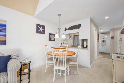 New Seabury, Mashpee Cape Cod vacation rental - Dining area for four, offering a cozy and comfortable space for meals with a simple, inviting setup ideal for everyday dining