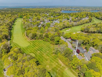 New Seabury, Mashpee Cape Cod vacation rental - Aerial view of the property and nearby golf course, showcasing the home’s scenic location