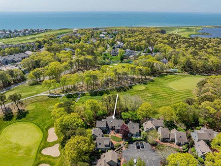 New Seabury, Mashpee Cape Cod vacation rental - Aerial view of the property and surrounding greenery, highlighting the home’s peaceful setting with lush natural landscapes and scenic outdoor surroun