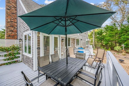 West Yarmouth Cape Cod vacation rental - Deck with dining and seating area
