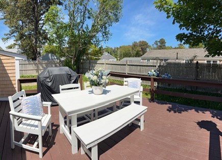 Dennis Port Cape Cod vacation rental - Back deck with BBQ and dining table