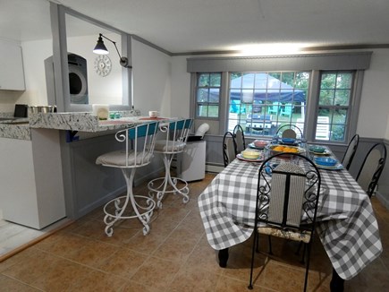 Centerville Cape Cod vacation rental - Dining/kitchen with view of full size washer/dryer and backyard