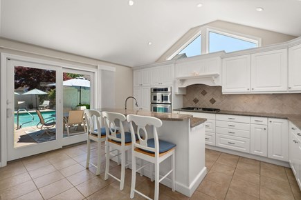 New Seabury, The Mews Cape Cod vacation rental - Large kitchen with center island overlooking pool