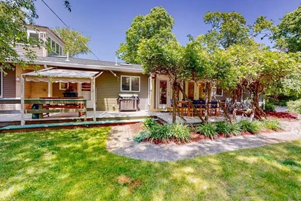Bourne Cape Cod vacation rental - Large private yard with wraparound deck and outdoor seating