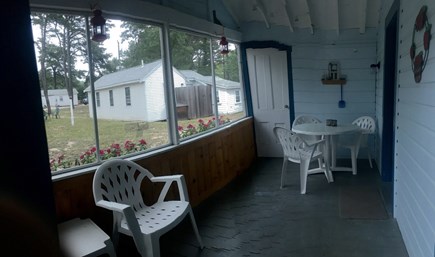 Outer Cape / Wellfleet Cape Cod vacation rental - Cozy seating on the screened-in porch.