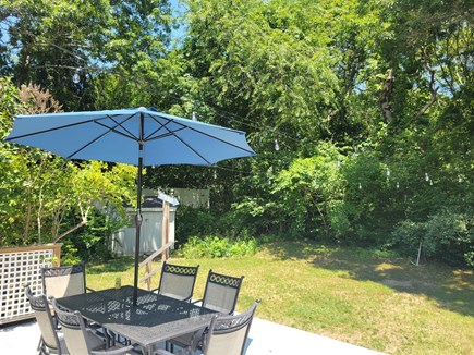 Sagamore Beach Cape Cod vacation rental - Secluded backyard abutting town woods with a path to Clark Field.