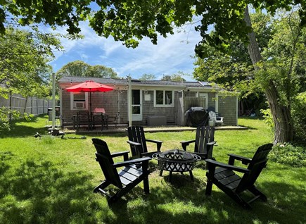 Dennisport Cape Cod vacation rental - Back of the cottage and fire pit.