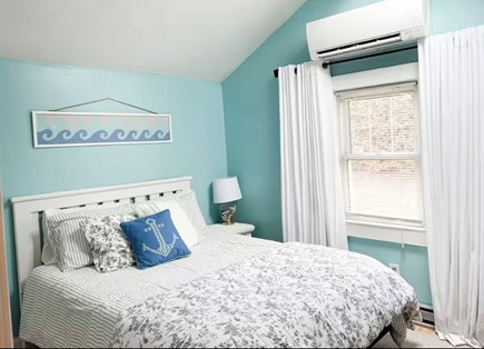 Dennisport Cape Cod vacation rental - Bedroom with queen bed, dresser, and washer/dryer closet.