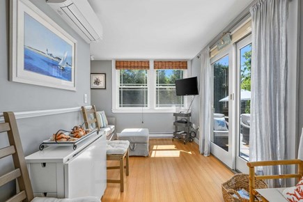 Chatham Cape Cod vacation rental - Convertible stand that transforms into a table with two chairs, offering a flexible and space-saving seating option for dining or work.