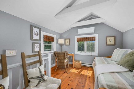 Chatham Cape Cod vacation rental - Additional sleeping area featuring a desk and a trundle bed with two twin mattresses, offering flexible space for guests or work.