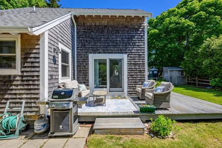 Chatham Cape Cod vacation rental - Back deck with outdoor seating and a grill, perfect for relaxing and enjoying outdoor meals.