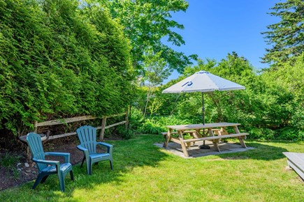 Chatham Cape Cod vacation rental - Backyard picnic table and chairs, ideal for outdoor dining and casual gatherings.