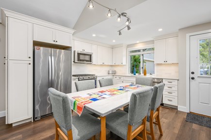 Mashpee Cape Cod vacation rental - A dining table positioned within the kitchen area, creating a convenient and functional space for meals