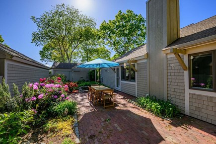 Mashpee Cape Cod vacation rental - Private patio framed by serene garden views,