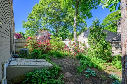 Mashpee Cape Cod vacation rental - Backyard garden views create a private and peaceful outdoor atmosphere.