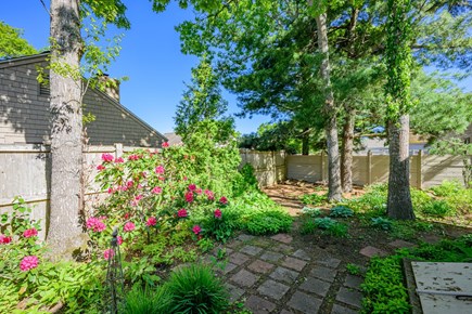 Mashpee Cape Cod vacation rental - Backyard garden views create a private and peaceful outdoor atmosphere.